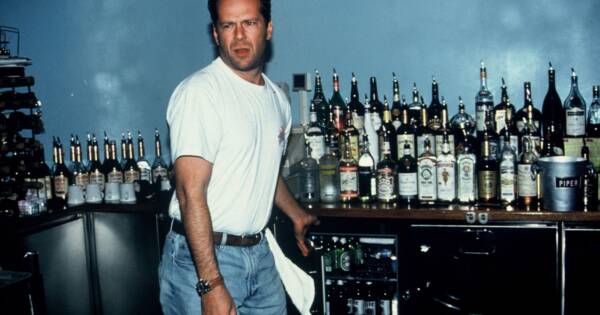 Bruce Willis Serving Up Some Cocktails at Planet Hollywood, 1993