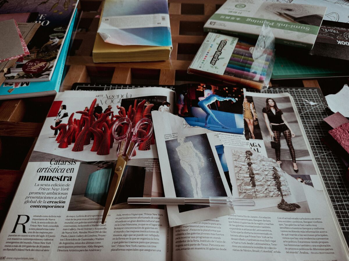 Open magazines with various articles and pictures.
