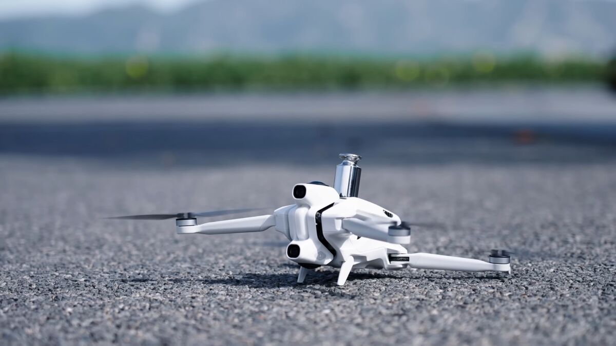 Antigravity A1 8K drone flying in a mountain landscape capturing 360 degree footage