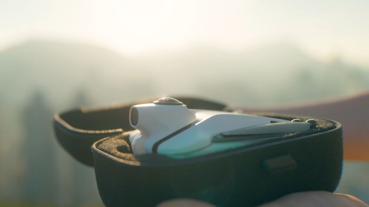 Antigravity A1 8K drone flying in a mountain landscape capturing 360 degree footage