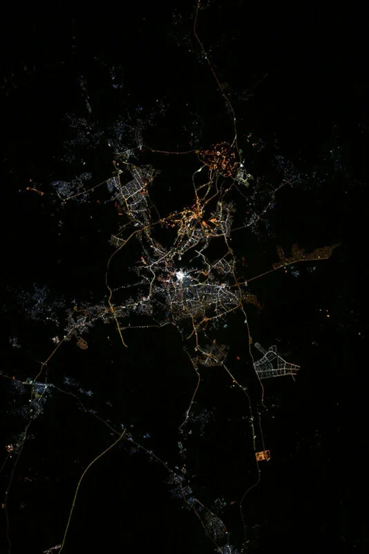 Nighttime ISS photograph of Mecca with the Grand Mosque glowing at the centre of the city