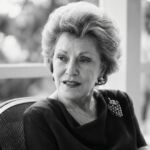 She sat at a yellow Formica kitchen table in Mount Vernon, New York—1951. Twenty…